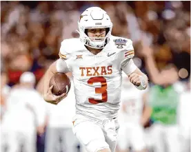  ?? Tom Fox/tribune News Service ?? Texas quarterbac­k Quinn Ewers will be throwing to a very different group of receivers next season after the departures of Xavier Worthy and Adonai Mitchell.