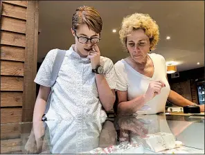  ?? AP/GILLIAN FLACCUS ?? Cindy Paul, 55 (right), and her daughter, Doc Paul, 31, both of Billings, Mont., shop for marijuana edibles at a store in Portland, Ore.