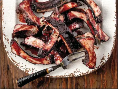  ?? The Washington Post/GORAN KOSANOVIC ?? Cherry-Glazed Baby Back Ribs break with the Texas norm of no sauces or glazes.