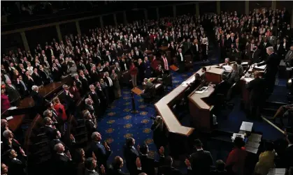  ?? Photograph: Jon Cherry/Reuters ?? Members of the 118th Congress raise their right hands as they are sworn into office last week.