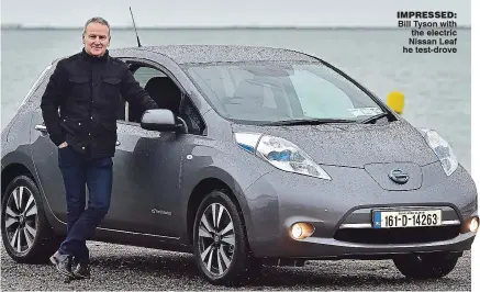  ??  ?? impressed: Bill Tyson with the electric Nissan Leaf he test-drove