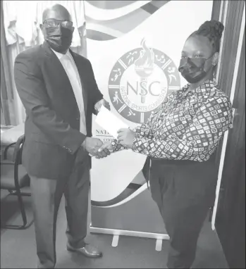  ?? ?? Director of Sport, Steve Ninvalle (L), handing over the NSC’s cheque to the GRFU’s Assistant/Secretary Treasurer, Tiffany Spencer.