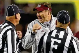  ?? BUTCH DILL / GETTY IMAGES ?? Mississipp­i State’s DanMullenm­ay get an offffer fromTennes­see, but he could elect to remain in Starkville withmany of his starters returning.