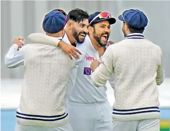  ?? — AP ?? India’s Mohammed Siraj (second left) celebrates with teammates after bowling out England’s Haseeb Hameed on the second day of their second Test at Lord’s cricket ground in London on Friday.