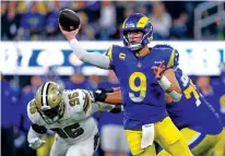  ?? RYAN SUN/THE ASSOCIATED PRESS ?? Los Angeles Rams quarterbac­k Matthew Stafford throws a pass during the second half of Thursday’s game against the New Orleans Saints in Inglewood, Calif.