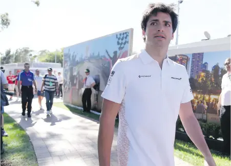  ??  ?? McLaren driver Carlos Sainz Jr. of Spain arrives at the track for the Australian Formula One Grand Prix in Melbourne, Australia. Ferrari has signed Sainz Jr. to a two-year deal starting in 2021.