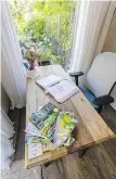  ?? ?? A desk in the cottage is where Zaffaroni does all her garden research. She is an intensely committed gardener who also likes to recycle, and found the glass windows second hand.