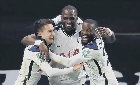  ??  ?? Tottenham Hotspur’s Moussa Sissoko (centre) celebrates scoring his side’s first goal of the game with his team-mates during the Carabao Cup semi-final match.