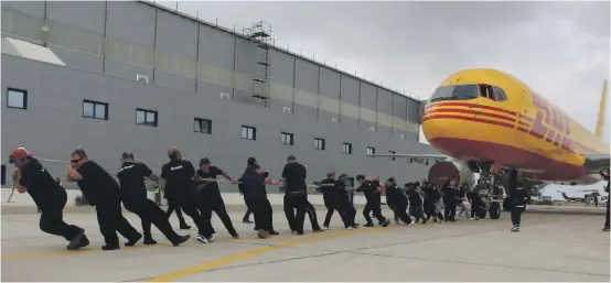  ??  ?? One of the teams taking part in Plane Pull Malta 3 – wearing gloves is going to be mandatory this year for health and safety reasons