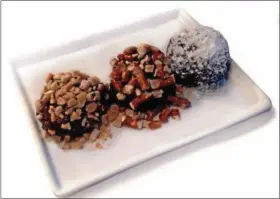  ?? PHOTO COURTESY OF WWW.GODSHALLS.COM ?? Love bacon? These truffles combine dark chocolate, bacon and cream cheese.