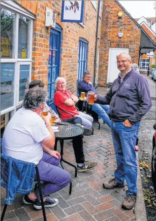  ?? Ref: 28-0820AH ?? Drinkers enjoy each other’s company outside Newbury’s micro pub the Cow and Cask, in Inch’s Yard