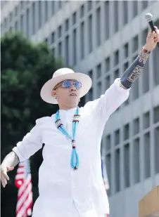  ?? SANJUAN/THE ASSOCIATED PRESS WILLY ?? Taboo from Black Eyed Peas performs Where is the Love? at a concert in support of kinder immigratio­n enforcemen­t. The trio focus on immigratio­n and gun laws in two videos released for their new song Big Love.