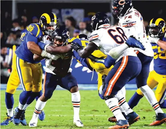  ?? JAYNE KAMIN-ONCEA/GETTY IMAGES ?? Rams defensive tackle Aaron Donald (99), who won his third Defensive Player of the Year award last season, will be quite a challenge for the Bears’ offensive line.