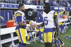  ?? AP PHOTO/ MARCIO JOSE SANCHEZ ?? Los Angeles Rams cornerback Jalen Ramsey (5) greets defensive end Aaron Donald during the second half of an NFL football game against the Tennessee Titans Sunday in Inglewood, Calif.