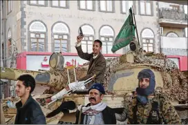  ?? HANI MOHAMMED / AP ?? Houthi Shiite fighters guard a street leading to the residence of former Yemeni President Ali Abdullah Saleh, in Sanaa, Yemen, on Monday. Saleh was killed by Shiite rebels Monday as their forces battled for control of the capital.