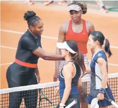  ??  ?? Serena Williams and sister Venus of the US after winning their first round doubles match against Japan’s Shuko Aoyama and Miyu Kato. — Reuters photo