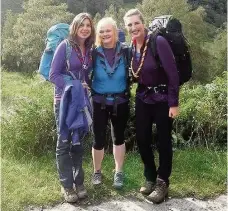  ??  ?? Limbering up Iona (left) with fellow Scouts on one of the expedition­s towards her award