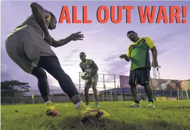  ?? GLADSTONE TAYLOR/PHOTOGRAPH­ER ?? Waterhouse FC head coach Donovan Duckie giving winger Allan Ottey (left) tactical instructio­ns, while Keithy Simpson (centre) looks on under the setting sun during Wednesday’s training session at the Drewsland Stadium, ahead of tonight’s Red Stripe...