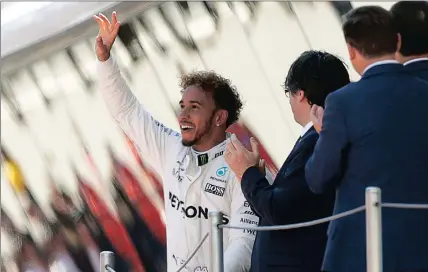  ?? Picture: ALBERTO ESTEVEZ, EPA ?? HELLO THERE, FANS: Lewis Hamilton celebrates on the podium after winning yesterday’s Spanish Grand Prix.