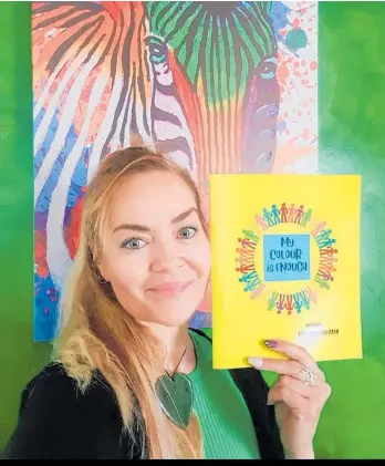  ?? Photo / Supplied ?? Kiri-michelle Mohi with her book, My Colour is Enough.