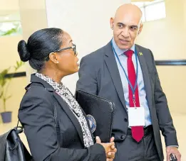  ?? ?? Rear Admiral Antonette Wemyss Gorman, chief of defence staff of the Jamaica Defence Force, and Commission­er of Police Major General Antony Anderson having a discussion at The Jamaica Pegasus hotel while attending the highlevel CARICOM Heads of Government meeting on the Haitian crisis.