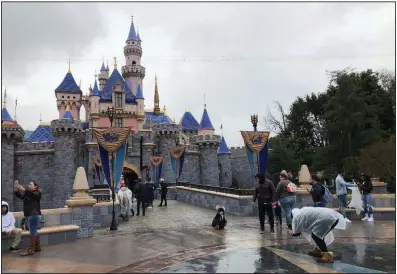  ?? (AP/Amy Taxin) ?? In early March, Disneyland in Anaheim, Calif., was still open to visitors, but Walt Disney Co. is expected to send out thousands of layoff notices on Sunday as coronaviru­s restrictio­ns have made it difficult to predict when its theme parks can reopen.