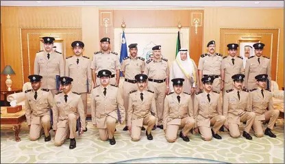  ?? MoI photo ?? Minister of Interior Sheikh Khalid Al-Jarrah, Lt-Gen Mahmoud Al-Dousari and Major General Sheikh Faisal Al-Nawaf with the new graduates.