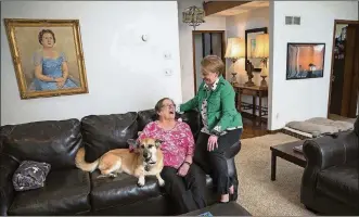  ?? KEVIN D. LILES/THE NEW YORK TIMES ?? Susan Yarbrough (right), 49; her 83-year-old mother, Betsy Yarbrough; and their dog, Maddie, share a home in Johns Creek, Ga. There has been a nationwide uptick in shared and multigener­ational households.