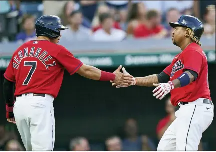  ?? TONY DEJAK — THE ASSOCIATED PRESS ?? Jose Ramirez, right, is congratula­ted by teammate Cesar Hernandez after hitting a three-run home run in the fourth inning.