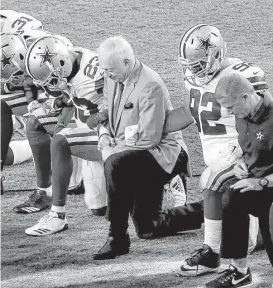  ?? Matt York / Associated Press ?? Owner Jerry Jones joined the Cowboys in taking a pre-anthem knee that was followed by the team standing for the anthem.