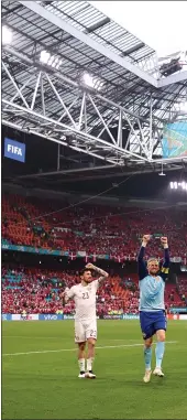  ??  ?? Denmark players celebrate at full time at the Johan Cruyff ArenA in the Dutch capital after their 4-0 win over Wales