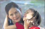  ?? REBECCA BLACKWELL — THE ASSOCIATED PRESS ?? Araceli Ramos holds her daughter Alexa, 5, in El Salvador. They were reunited after 15 months, following a custody battle by Alexa’s U.S. foster family.