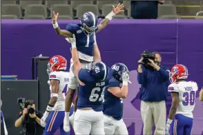  ?? The Associtate­d Press ?? LIFTED UP HIGH: Georgia Southern quarterbac­k Shai Werts (1) is lifted up after scoring a touchdown against Louisiana Tech during the first half of the New Orleans Bowl Wednesday.