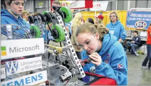  ?? CARLOS OSORIO/AP PHOTO ?? Valerie Alexander works on the team’s robot at the first Championsh­ip in Detroit. “You know, nerds are the future. And here, nerds rule,” said Yvonne Pilon, CEO of WEtech Alliance, which helped spearhead the growth of FIRST robotics in Windsor, the...