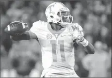  ??  ?? Dobbs making a pass: Tennessee quarterbac­k Joshua Dobbs looks for a receiver during the first half of a game against Kentucky, in Lexington, Ky.