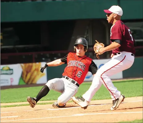  ?? File photo by Ernest A. Brown ?? Tolman’s Peter Microulis (2) seems to enjoy when the Tigers play their home games at McCoy Stadium. The senior earned the win in last week’s game against Woonsocket and he was the winning pitch again in Monday’s 7-5 Division II win over St. Raphael at...