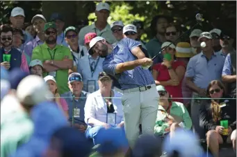  ?? MATT SLOCUM — THE ASSOCIATED PRESS ?? Scottie Scheffler hits his tee shot on the seventh hole during second round at the Masters golf tournament at Augusta National Golf Club Friday, April 12, 2024, in Augusta, Ga.