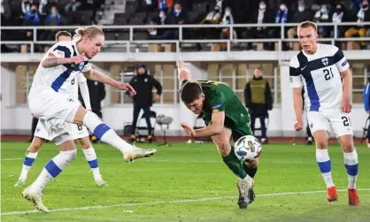  ??  ?? Fredrik Jensen scores Finland’s winner in the second half in Helsinki. Photograph: Kimmo Brandt/EPA