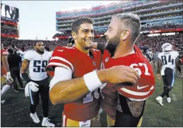  ?? D. Ross Cameron ?? The Associated Press San Francisco quarterbac­k Jimmy Garoppolo, left, and teammate Daniel Kilgore after a 25-23 victory over the visiting Tennessee Titans on Dec. 17.