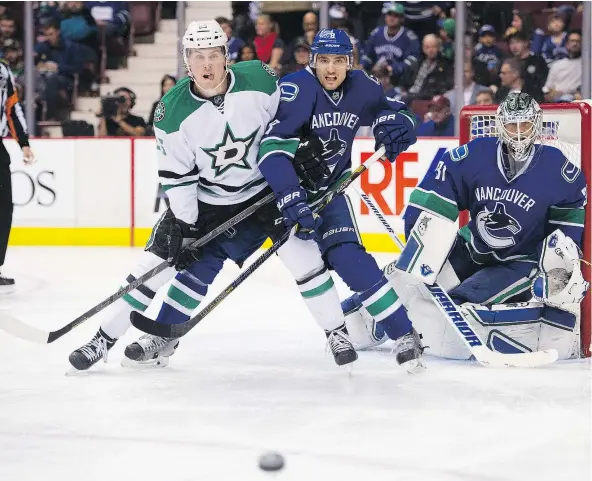  ?? GERRY KAHRMANN/PNG FILES ?? The Canucks should consider dealing capable defenceman Chris Tanev and a fourth-round pick to the defensivel­y-challenged Dallas Stars in exchange for the third overall selection in the 2017 NHL draft, columnist Ben Kuzma believes.