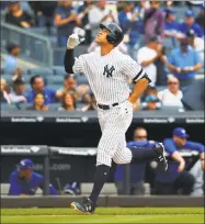  ?? Jim McIsaac / Getty Images ?? The Yankees’ Aaron Judge reacts after hitting a home run in the fourth inning Saturday.