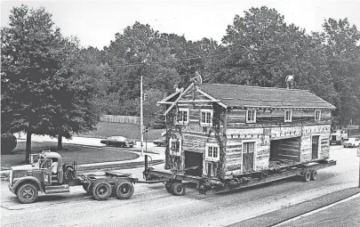  ??  ?? A log cabin is moved to the Libertylan­d site on Sept. 16, 1975. The park, which opened on July 4, 1976, struggled through several money-losing years and closed after the 2005 season. FRED GRIFFITH/THE COMMERCIAL APPEAL