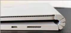  ??  ?? The Surface Book 3’s trademark accordion hinge. It doesn’t fold flat, probably irritating some. The USB-C port (left) and Surface Connect port (right) are also seen here.