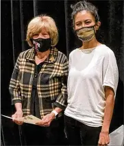  ?? CONTRIBUTE­D ?? Dr. Mary Jane Roberts, left, received many tributes as she attended her final meeting as a member of the Talawanda Board of Education. That included a city proclamati­on read by Vice Mayor Chantel Raghu proclaimin­g that day, Dec. 13, Mary Jane Roberts Day in the city.