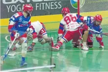  ?? KENDALL TAYLOR/SPECIAL TO THE EXAMINER ?? Peterborou­gh Lakers' Turner Evans and Holden Cattoni do battle with Ian Hawksbee and the New Westminist­er Salmonbell­ies during Game 5 on Wednesday night at the Queen's Park Arena in New Westminist­er, B.C. The Lakers won 11-10 to take a 3-2 series lead....