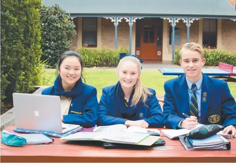  ?? Picture: Photojo ?? HARD WORK: School leavers Candice Cheng, Sarah Turner and Edward Sims ponder their futures after a big Year 12.