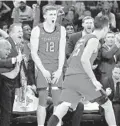  ?? KATHY WILLENS/AP ?? Texas Tech players whoop it up during the second half against No. 1 Louisville.