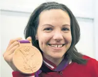  ?? RYAN REMIORZ/THE CANADIAN PRESS ?? Canada's Christine Girard originally won bronze in London, but the two weightlift­ers ahead of her tested positive for drug use.