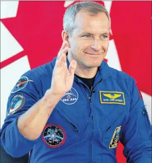  ?? CP PHOTO ?? Canadian astronaut David Saint-Jacques waves as he is introduced during an event with students Wednesday in Ottawa.