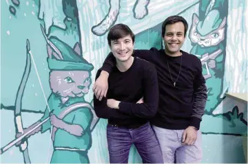  ??  ?? PALO ALTO: In this Wednesday, Dec 2, 2015, photo, Robinhood co-founders Vlad Tenev (left) and Baiju Bhatt pose at company headquarte­rs in Palo Alto, Calif. Robinhood is a stock brokerage that does not charge any commission­s for its more than 1 million...